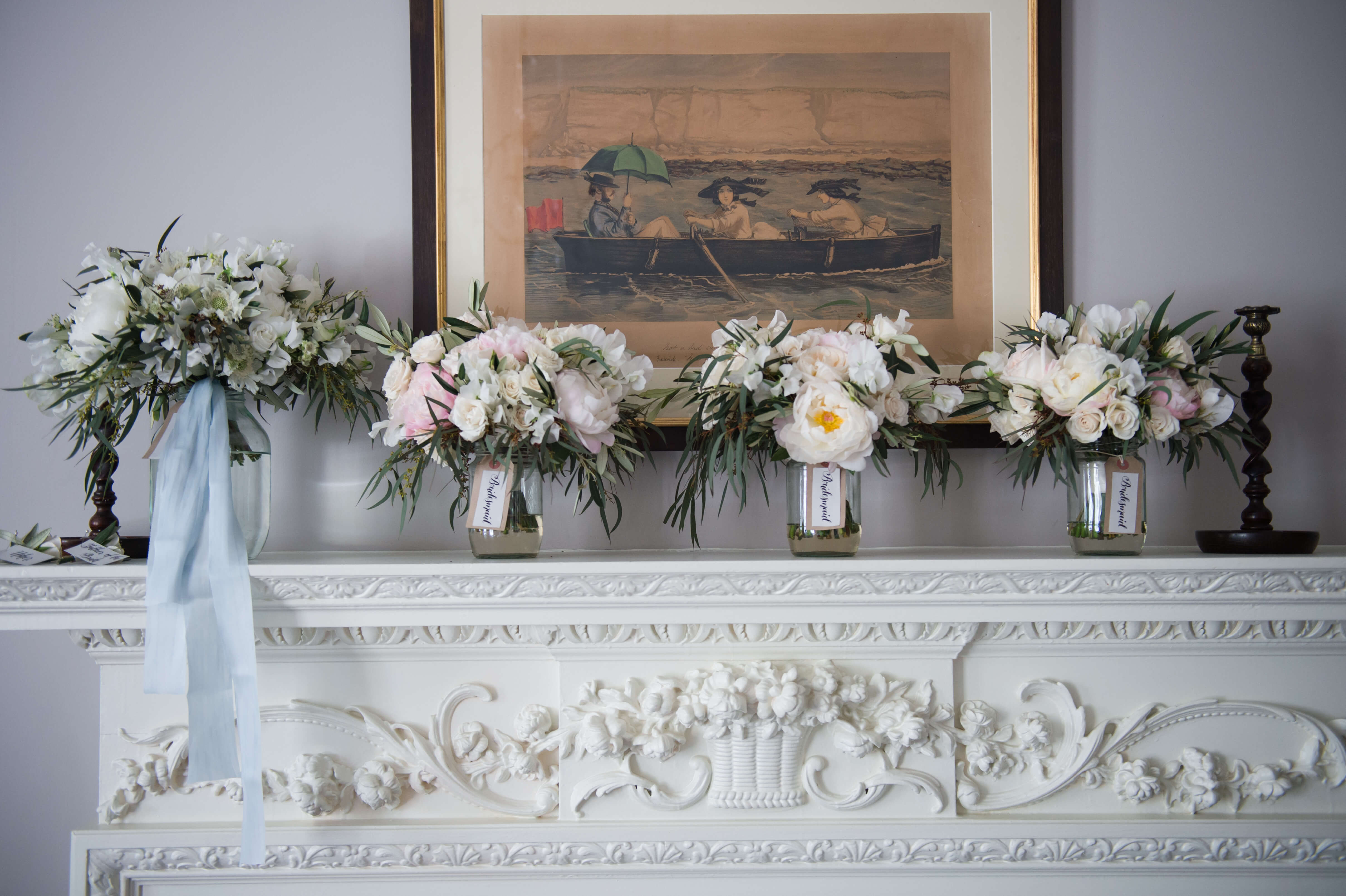 bridal bouquets on the mantel piece at the pig on the beach
